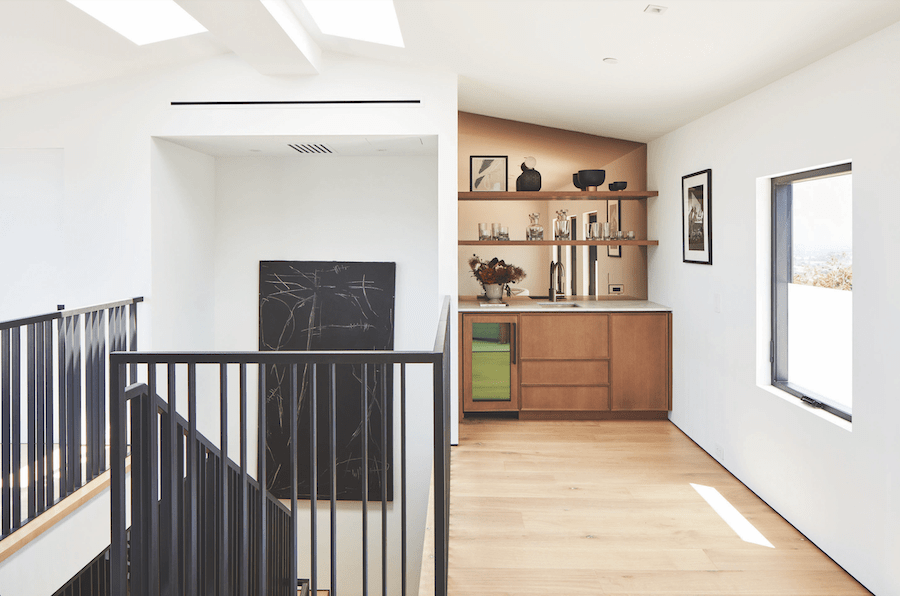 The wet bar and light-filled interior of a 2023 BALA winning remodel  