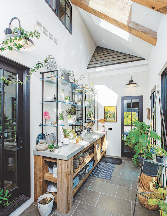 An bright, enclosed breezeway meets the homeowner's garden needs