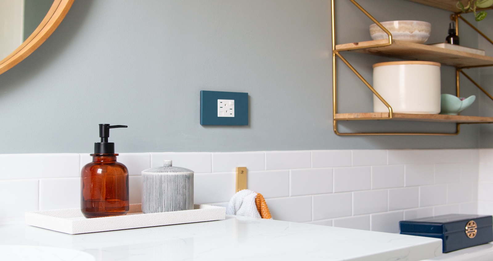 Bathroom vanity featuring Adorne wall plate on backwall