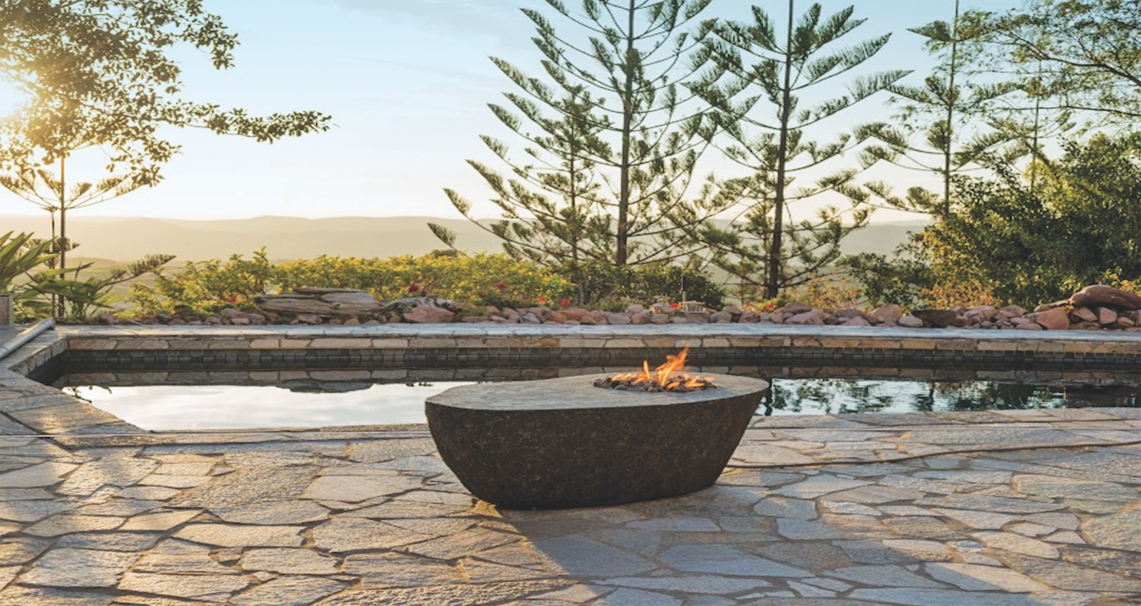 Outdoor fire pit next to pool