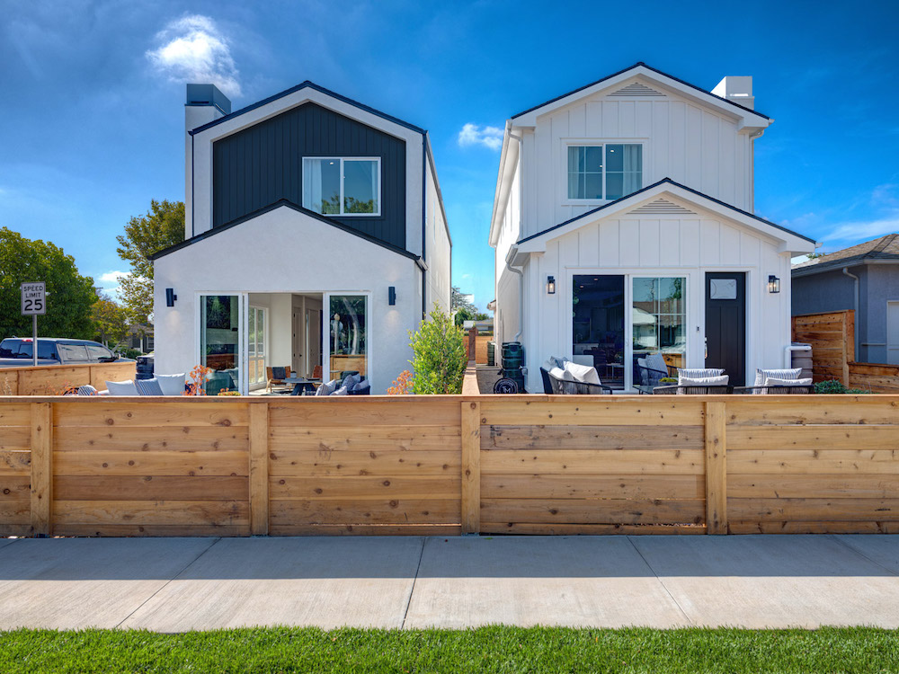 Back view of two Thomas James Homes duplexes on split lot