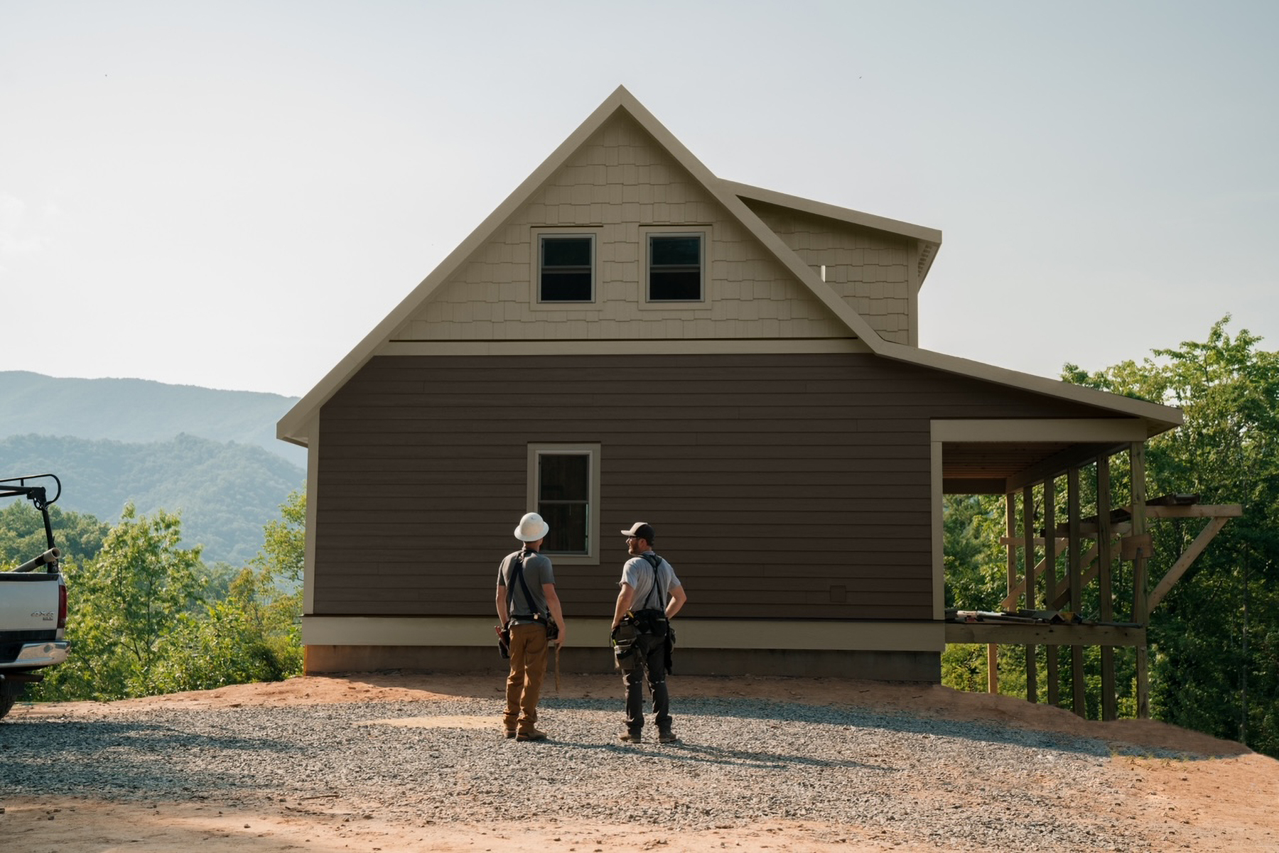 Perkins Builder Brothers in front of house