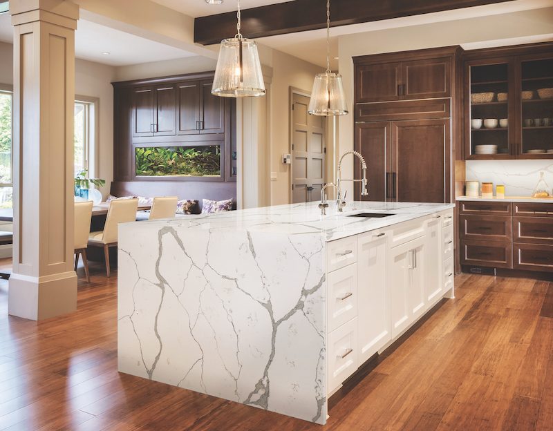 Corian Quartz Calcatta Natura surfacing in the kitchen with wood cabinets