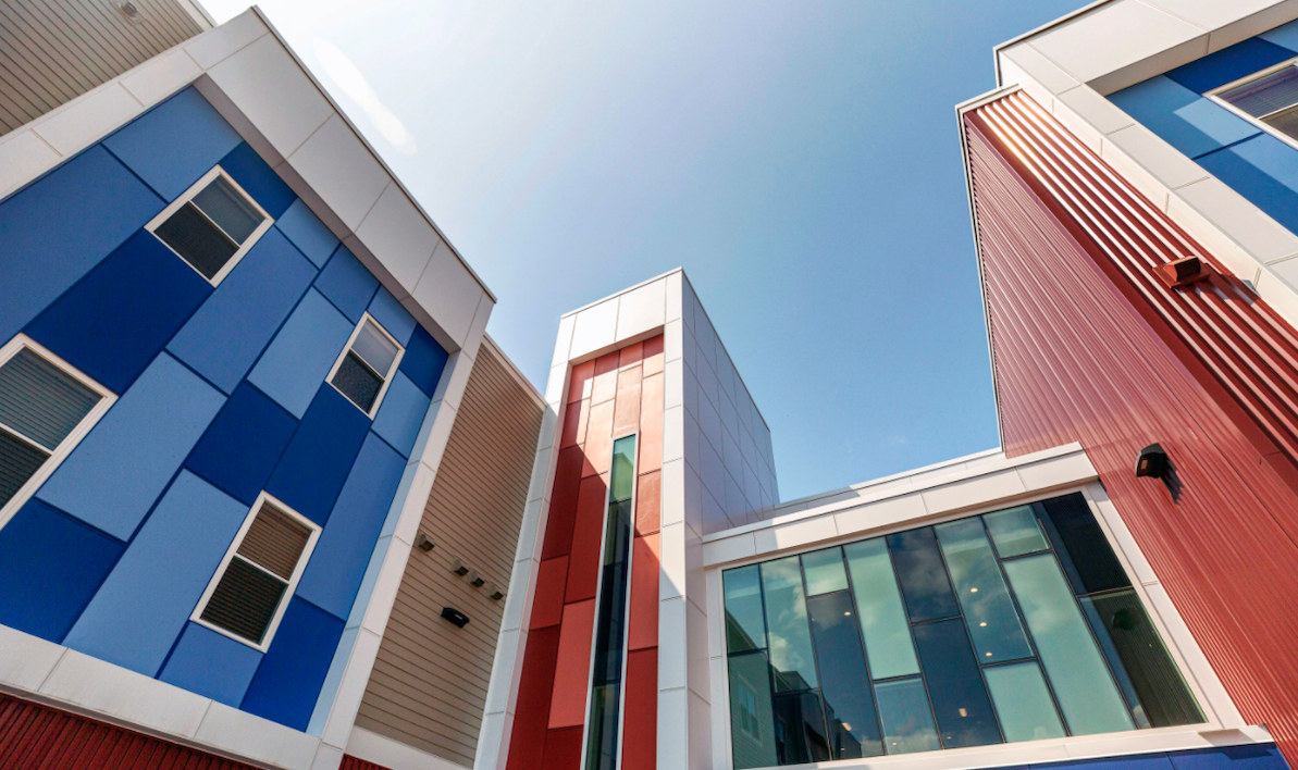 Fiber cement siding and metal panel exterior at Freedom Commons