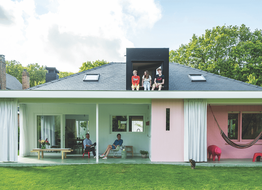 One example of reinventing home building: Exterior view of G-Lab house in Bruges with occupants enjoying upstairs and downstairs