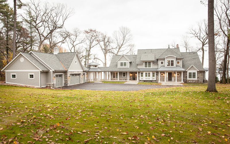 Exterior of custom lake home built using BuildTools construction management software.