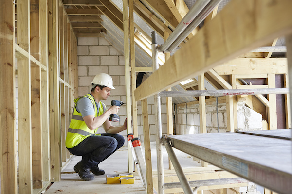 Construction worker using gun