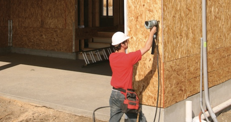 engineered wood framing continuous sheathing being installed