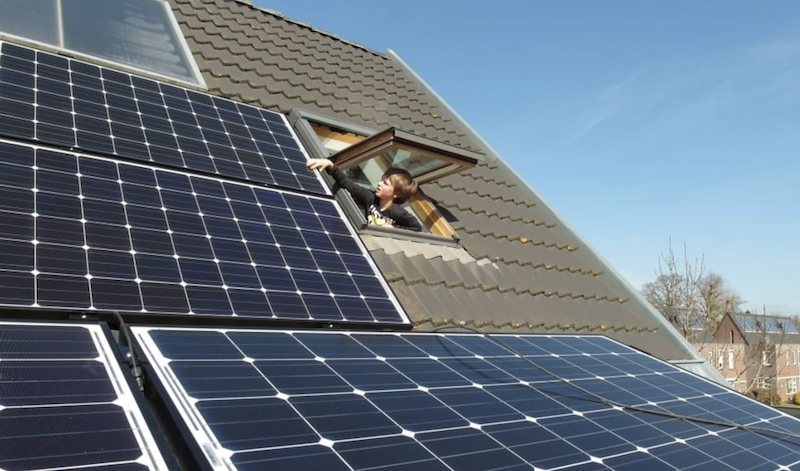 solar panels on rood with operable skylight so you can reach out and touch the panels