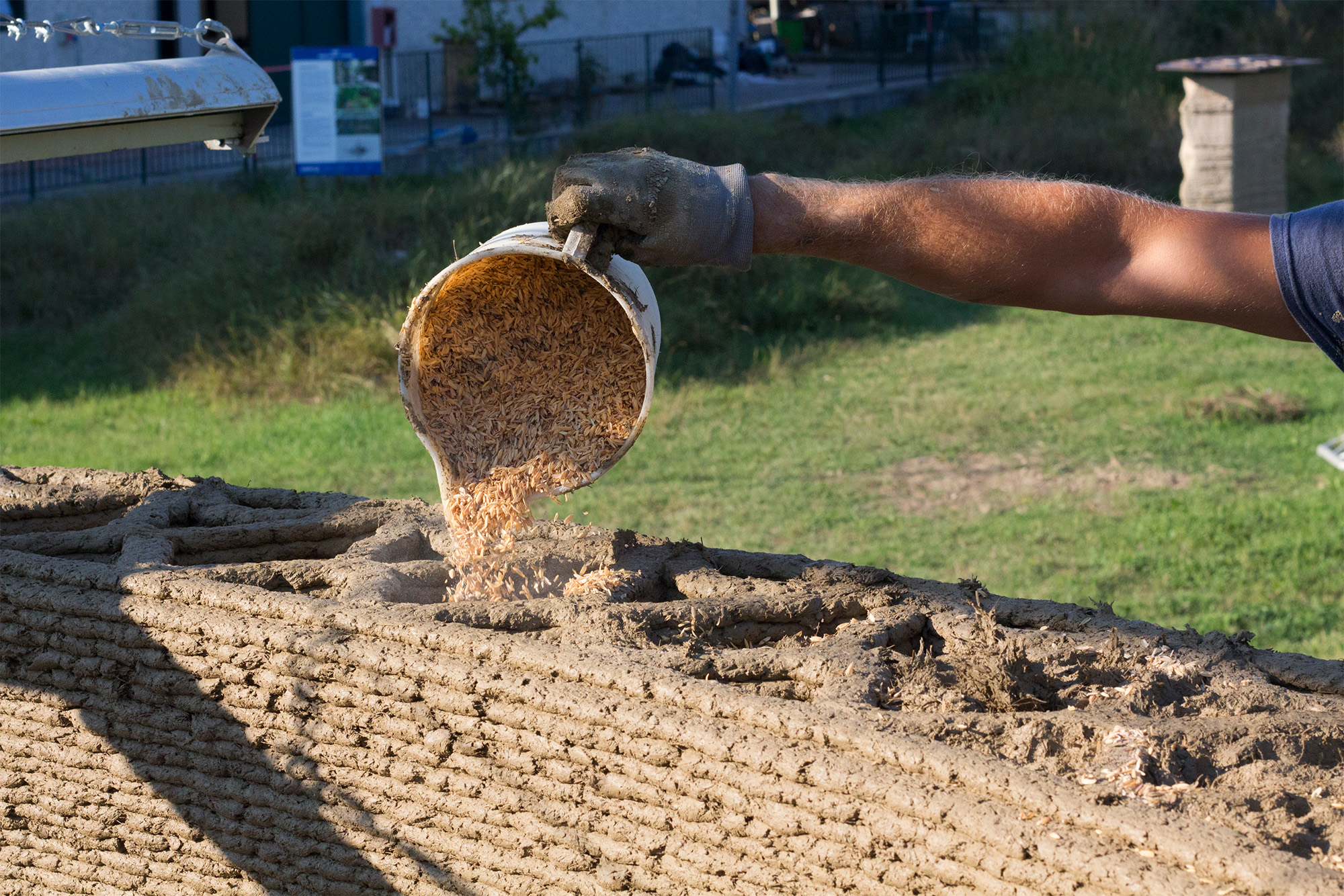 3D printed house with rice fibers and soil