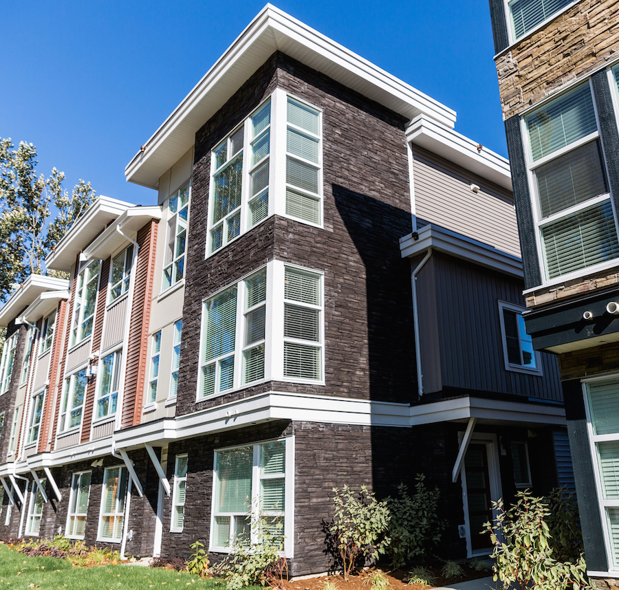 Versetta Stone’s bold Northern Ash color add a visual pop against this property’s more neutral tones