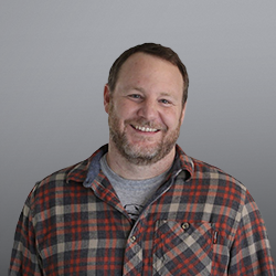 Matthew Blomquist headshot grey background