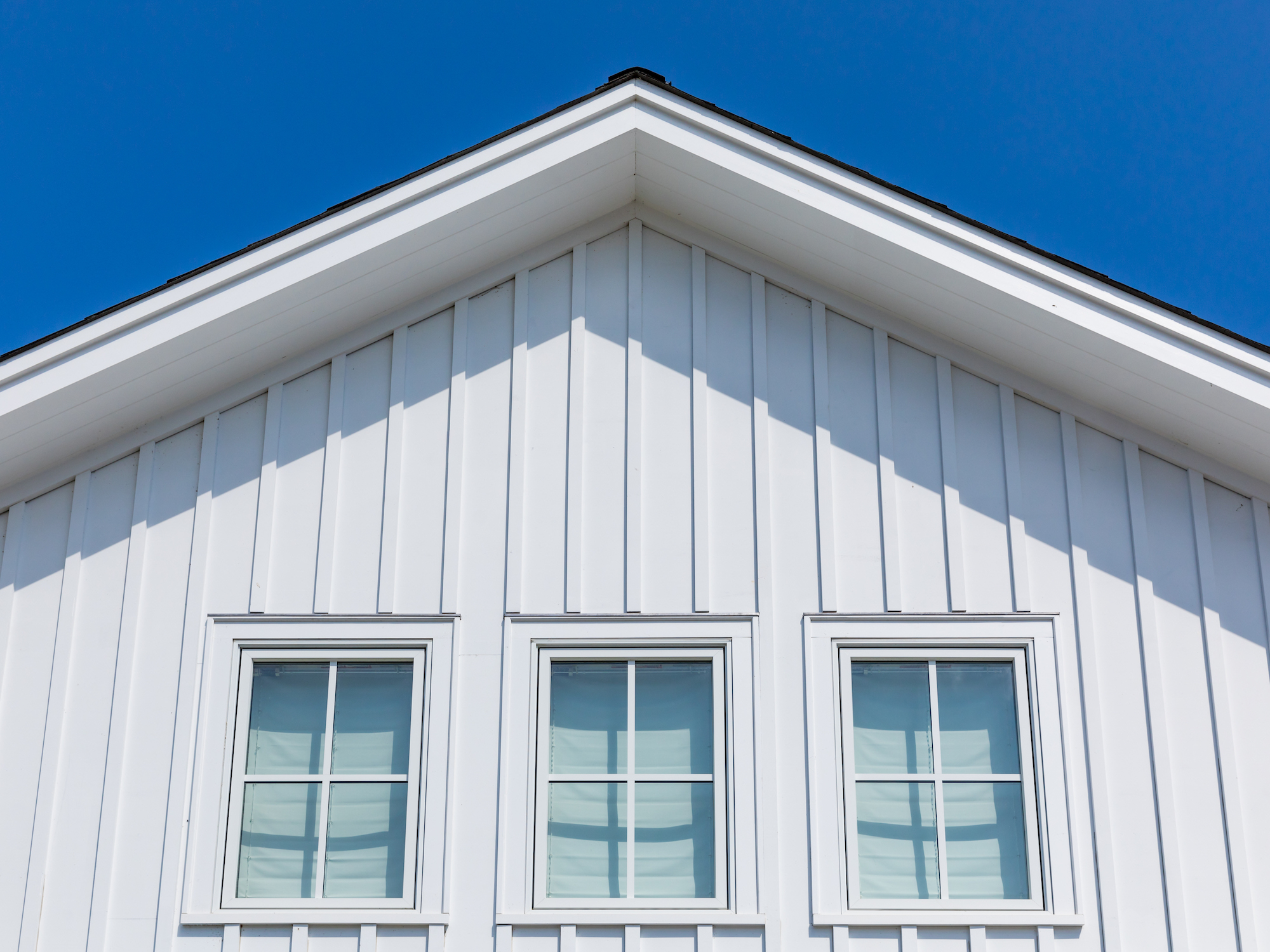 Board and batten siding made with TruExterior poly-ash trim