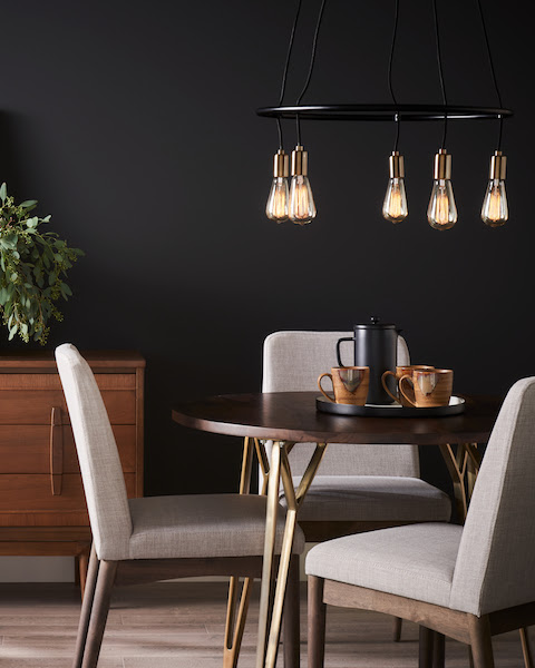 Sherwin Williams Color Survey dark walls pendant lights chairs