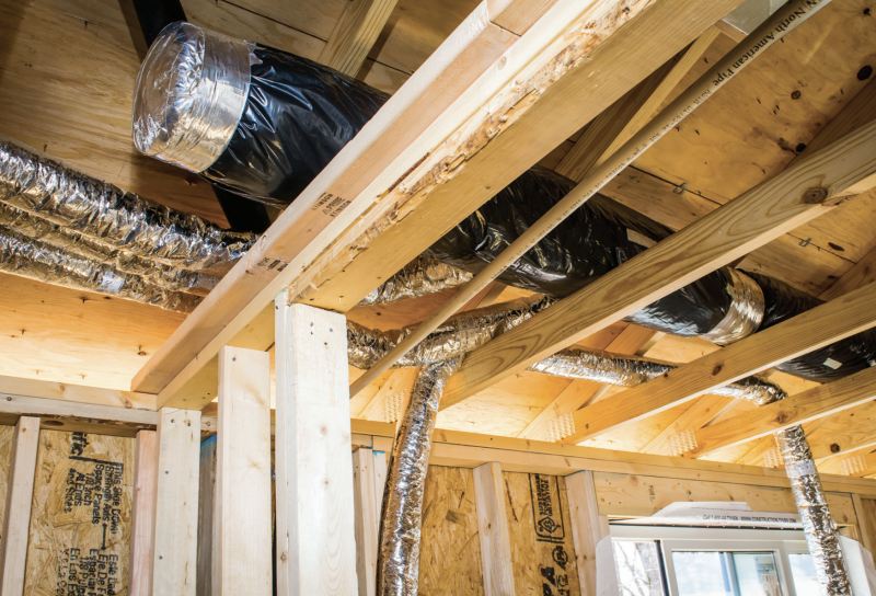 air handling unit that's been installed above the ceiling of a home's top floor bedroom