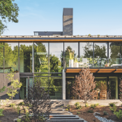 Glassy rear facade of the Burch Creek Home, a 2023 BALA winner 