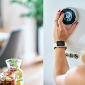 Woman turns dial on thermostat