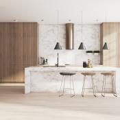 A newly renovated kitchen with a marble island in the center