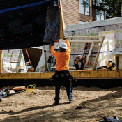 home construction placing wall panel 