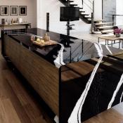 Cambria Mersey black quartz surfacing with white veining installed on kitchen island in modern home