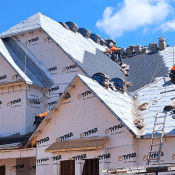 Installing a roof on a new home using roofing underlayment