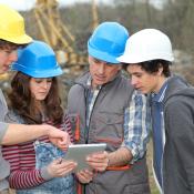 Construction students and instructor on job site of master planned community