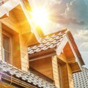 Sun reflecting off tiled roof of single-family home