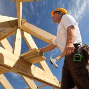 Construction worker framing a house