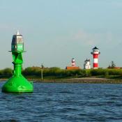 Bouy and light house in harbor