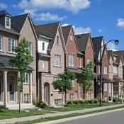 Modern red brick townhouses on residential street