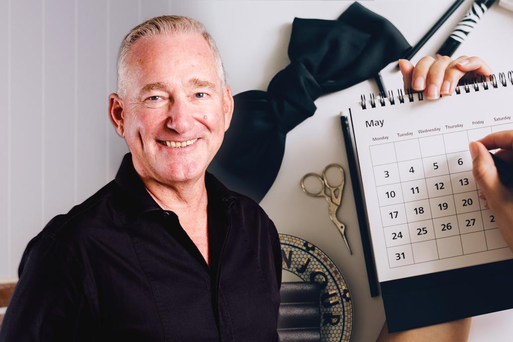 Man's headshot in front of yearly calendar stock photo