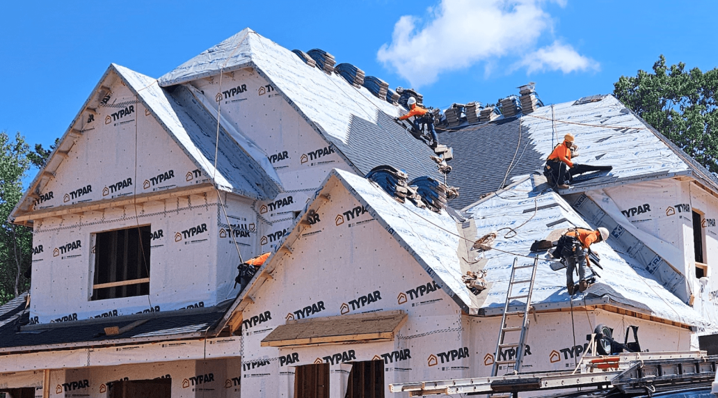 Installing a roof on a new home using roofing underlayment