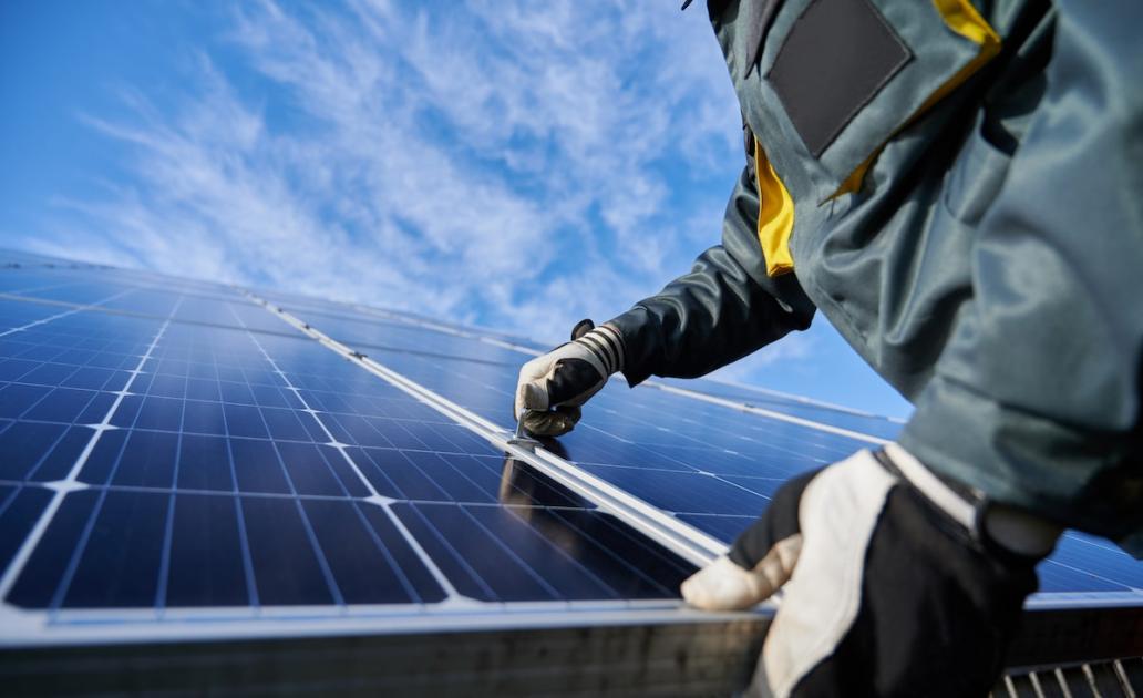 Solar panels being installed on residential roof