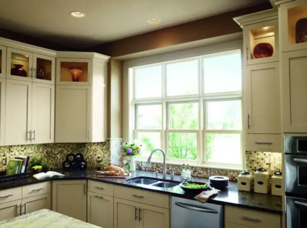 windows over kitchen sink admit plenty of natural light