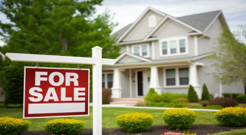 For Sale sign in front yard of house as Wall Street hedge funds buy single-family homes