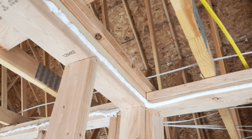 New-home framing with air-sealing product applied