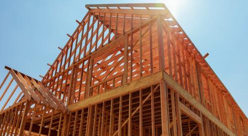 An upward view of a single-family home under construction