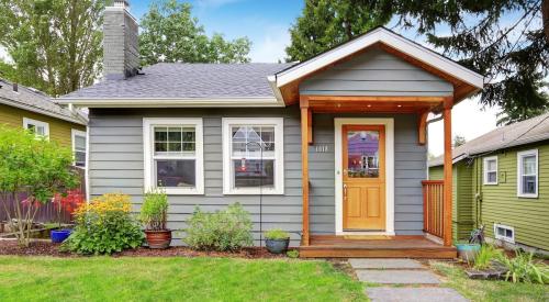 Small blue house with wooden front porch