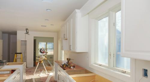 Kitchen cabinets and island in the middle of a remodel project