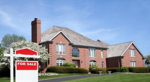 Luxury single-family home sits in background with "for sale" sign in front yard