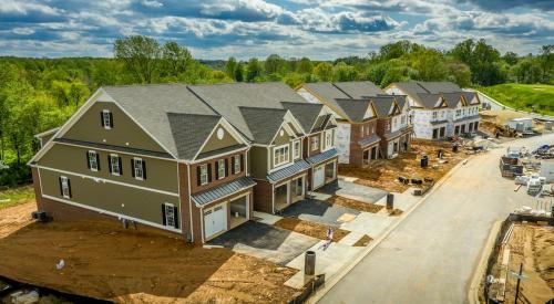 A row of new homes sits under construction