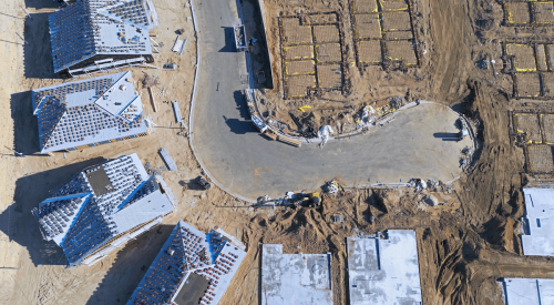 Aerial view of site preparation for new single-family homes under construction