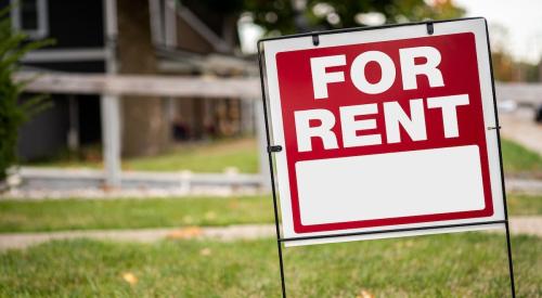 "For Rent" sign outside a rental home