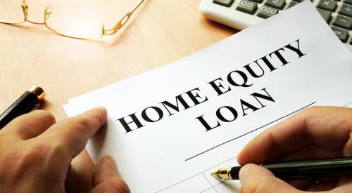 A homeowner signs a home equity loan