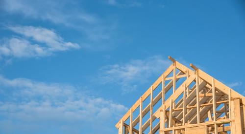 Framed home against blue sky