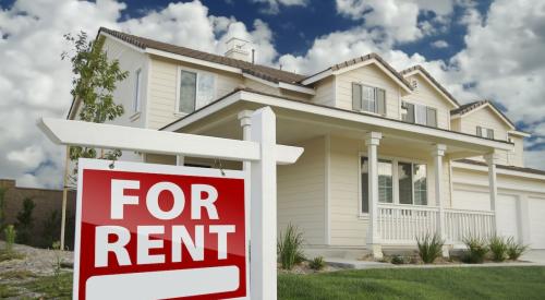 A single-family home that has a red "For Rent" sign in the front yard