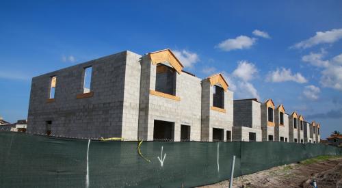 A row of townhomes sit under construction 