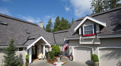 Traditional Farmhouse driveway with American Flag in front