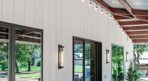 Austin barn house vertical siding with Acre sheets