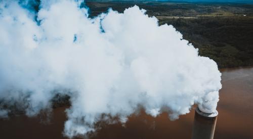 Smoke coming out of chimney stock image